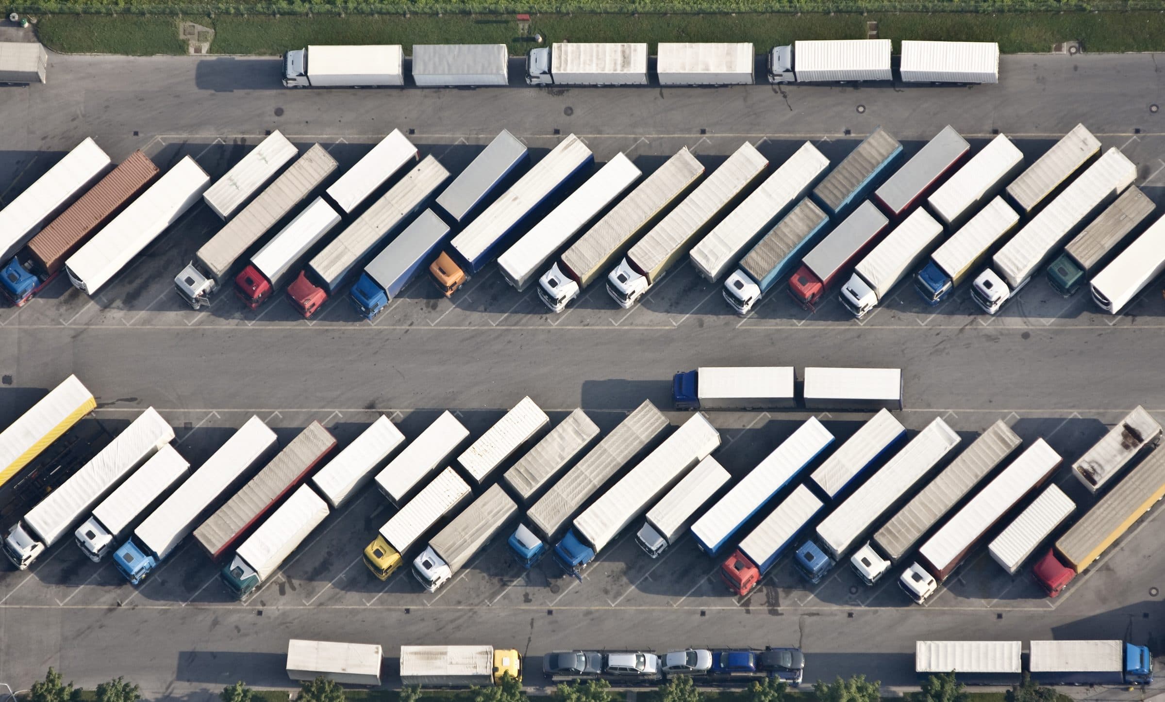 Aerial view of trailers parked in rows at a truck yard